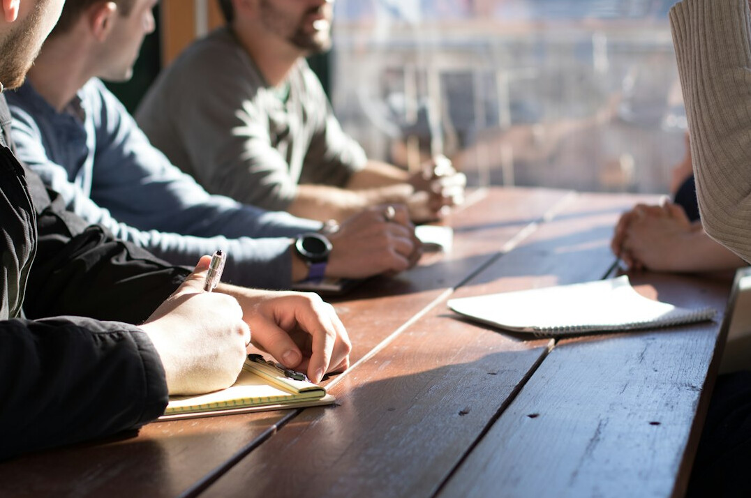 people discussing in meeting room