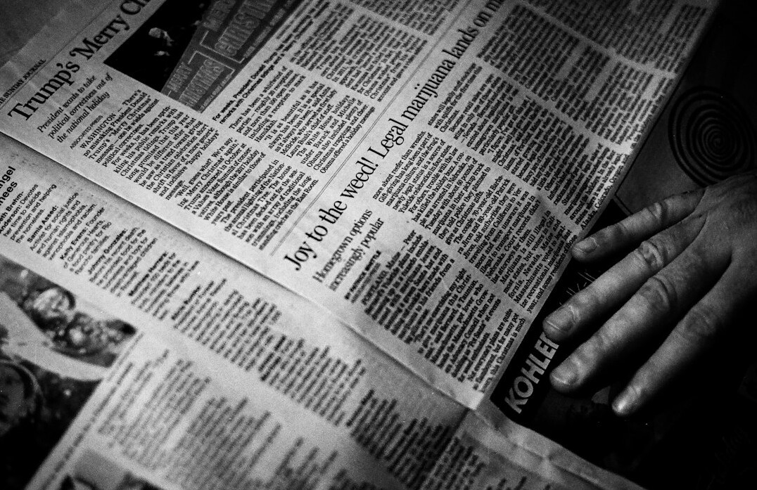 person reading newspaper